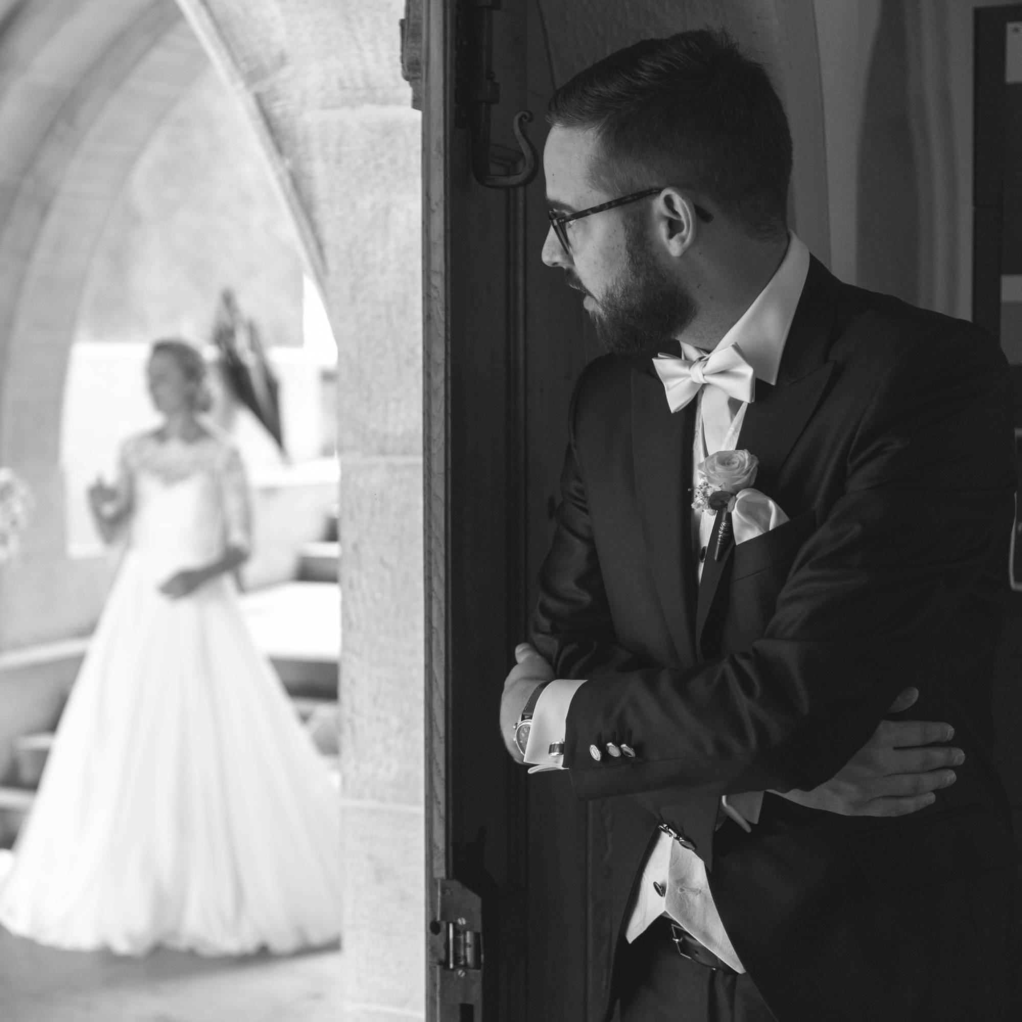 Bespoke Wedding Suit Fitting Process Tailor fitting a bespoke wedding suit for a groom in Savile Row