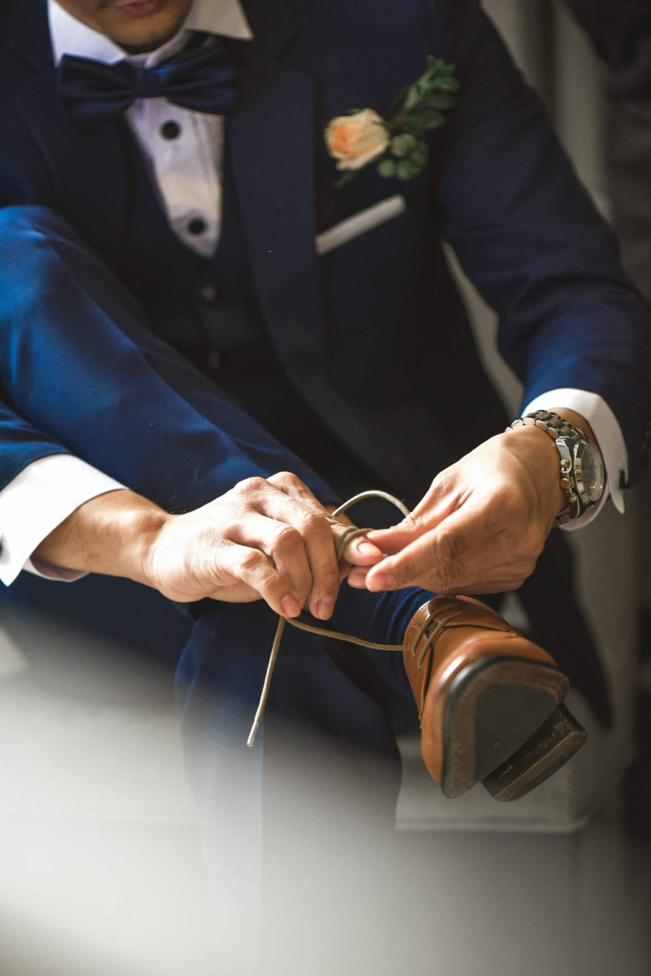 Savile Row Wedding Suit Craftsmanship Detailed view of hand-stitched lapel on a bespoke wedding suit