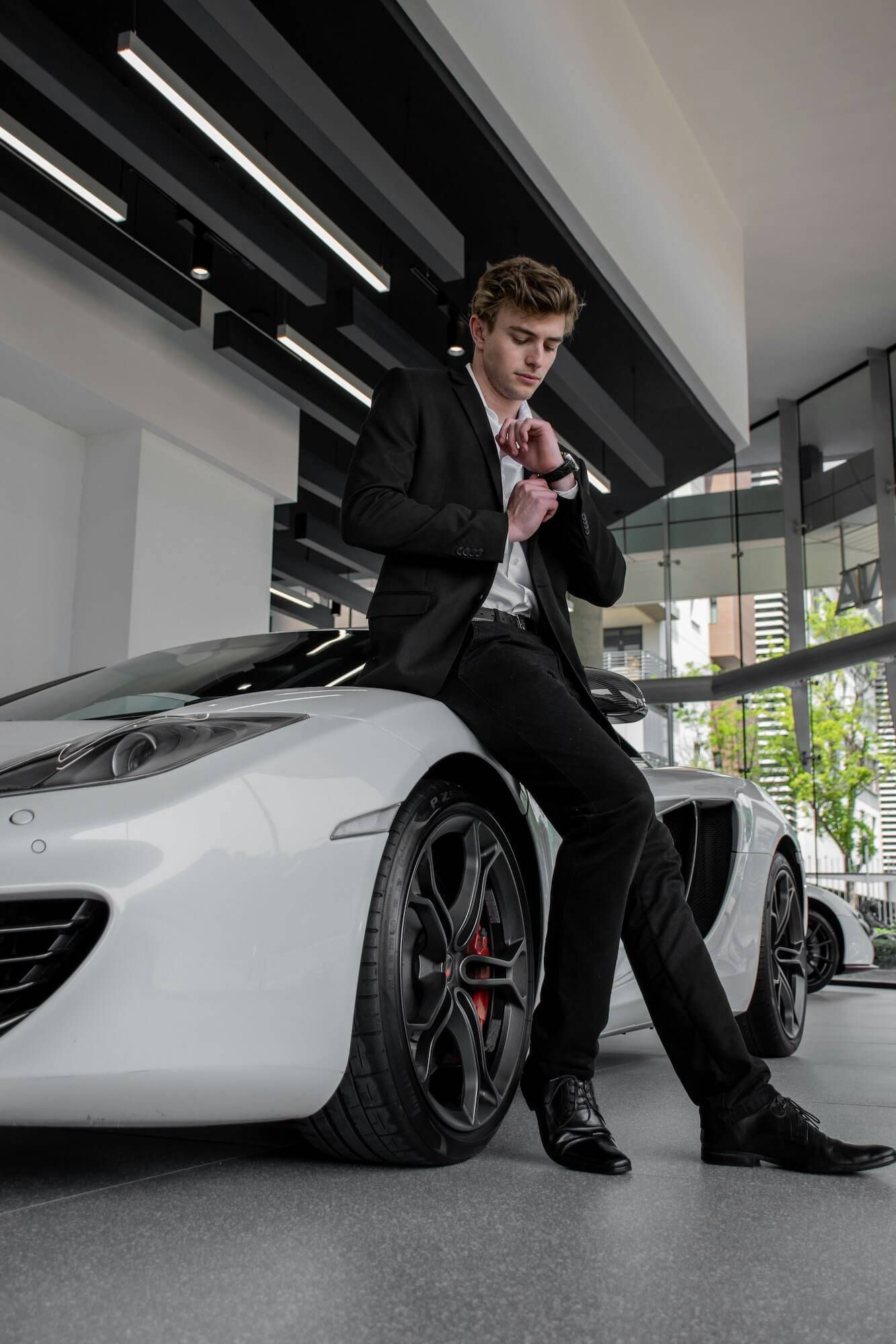 Modern British Business Suit Tailoring Master tailor crafting a modern British business suit on Savile Row